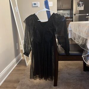 Black and sparkly long sleeve dress.